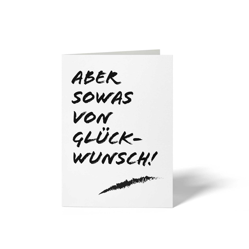 Vorderseite der geschlossenen A6 Glückwunschkarte von GHG Supplies mit dem dynamischen, schwarzen Schriftzug ABER SOWAS VON GLÜCKWUNSCH! im modernen Pinselstrich-Design auf weißem Grund.